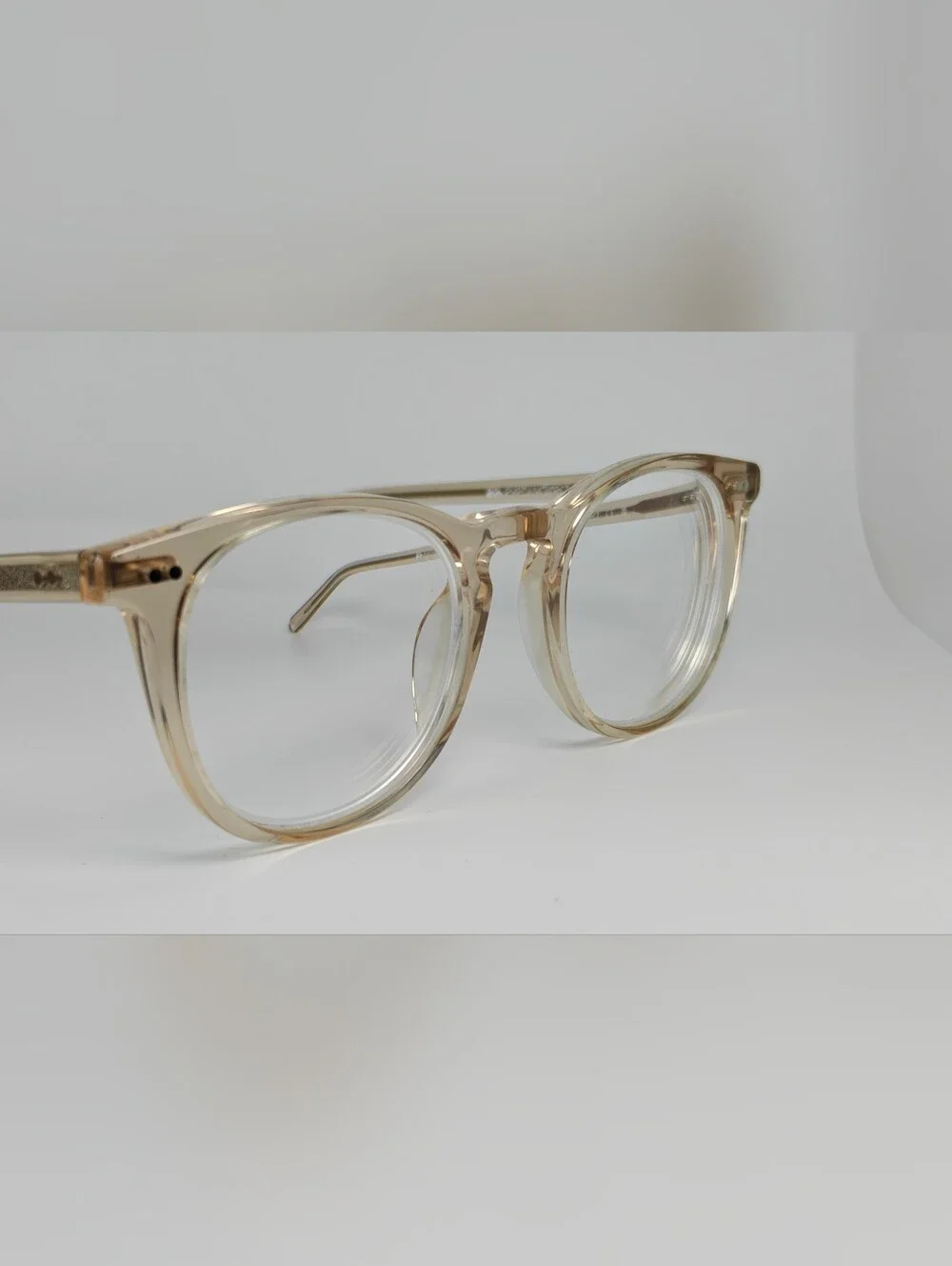 Ona. RFLKT. Clear Beige Round Frame Glasses.